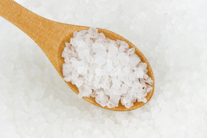 Salt crystals in wooden scoop.